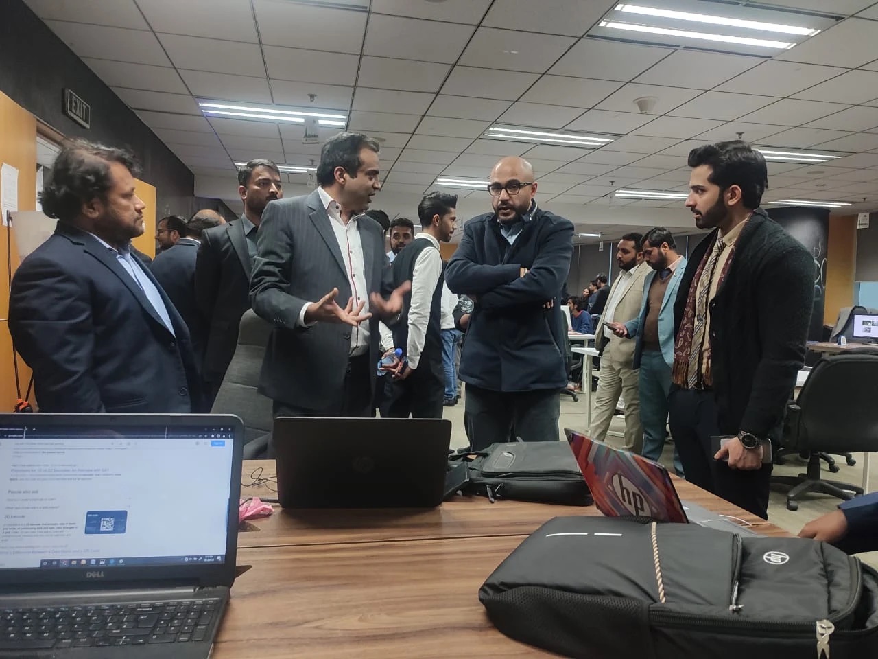 Solutions Wave engineers and client stakeholders reviewing a build together at the Lahore office