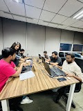 Solutions Wave developers working side by side at their desks